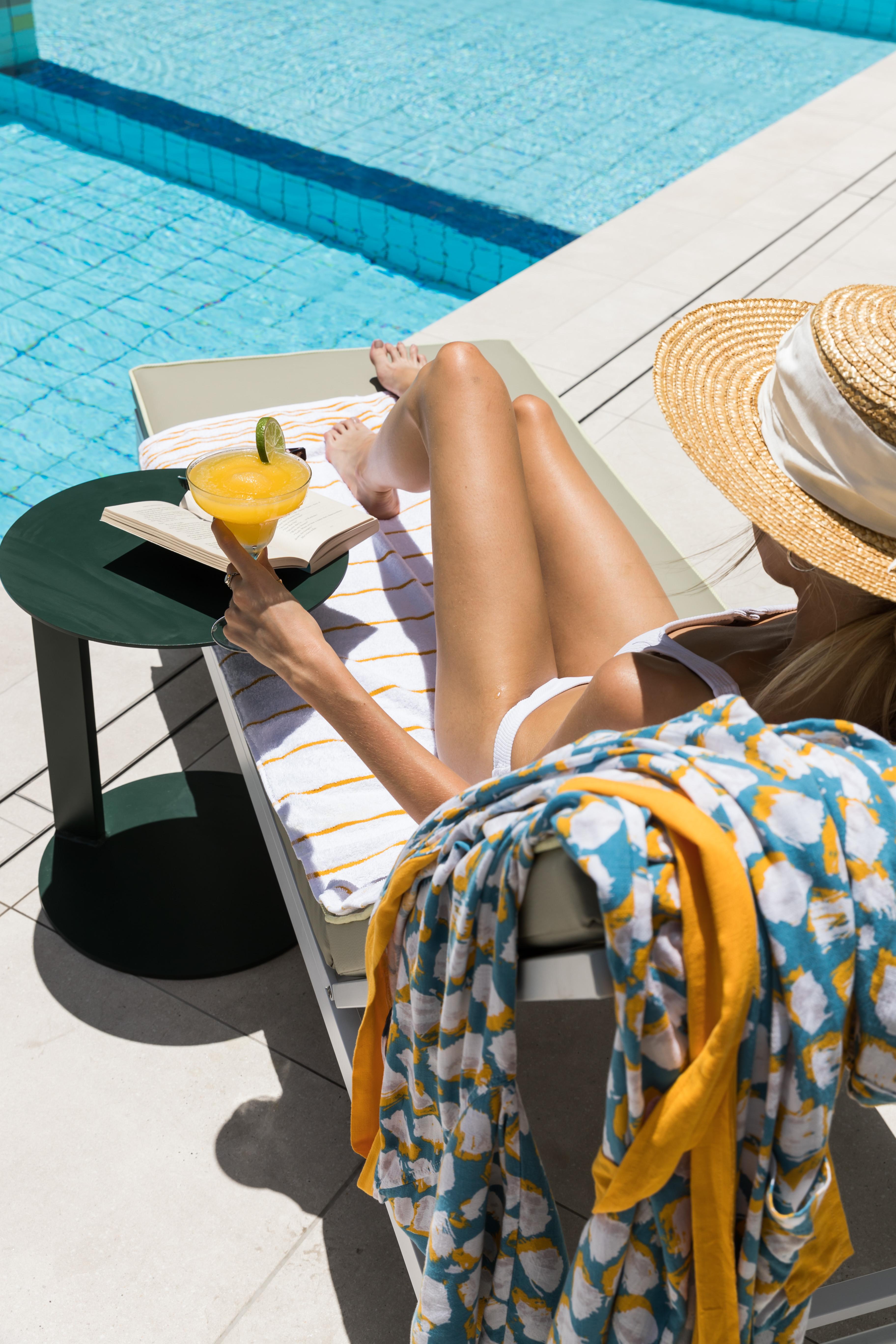 Crystalbrook Bailey Hotel Cairns Exterior photo A woman sunbathing