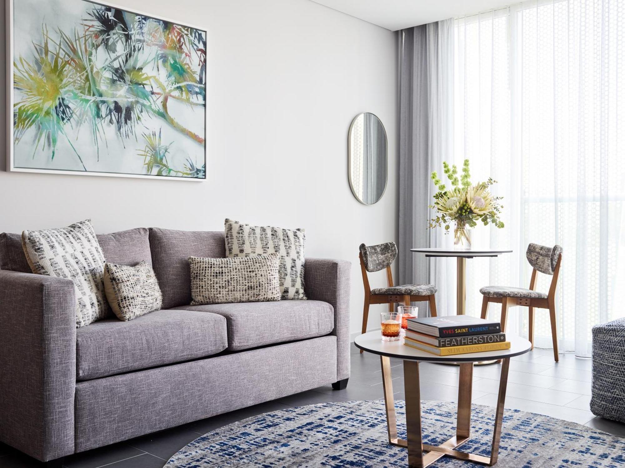 Crystalbrook Bailey Hotel Cairns Exterior photo A living room in a serviced apartment in Singapore